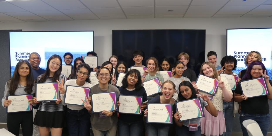 Students with their certificate of completion.